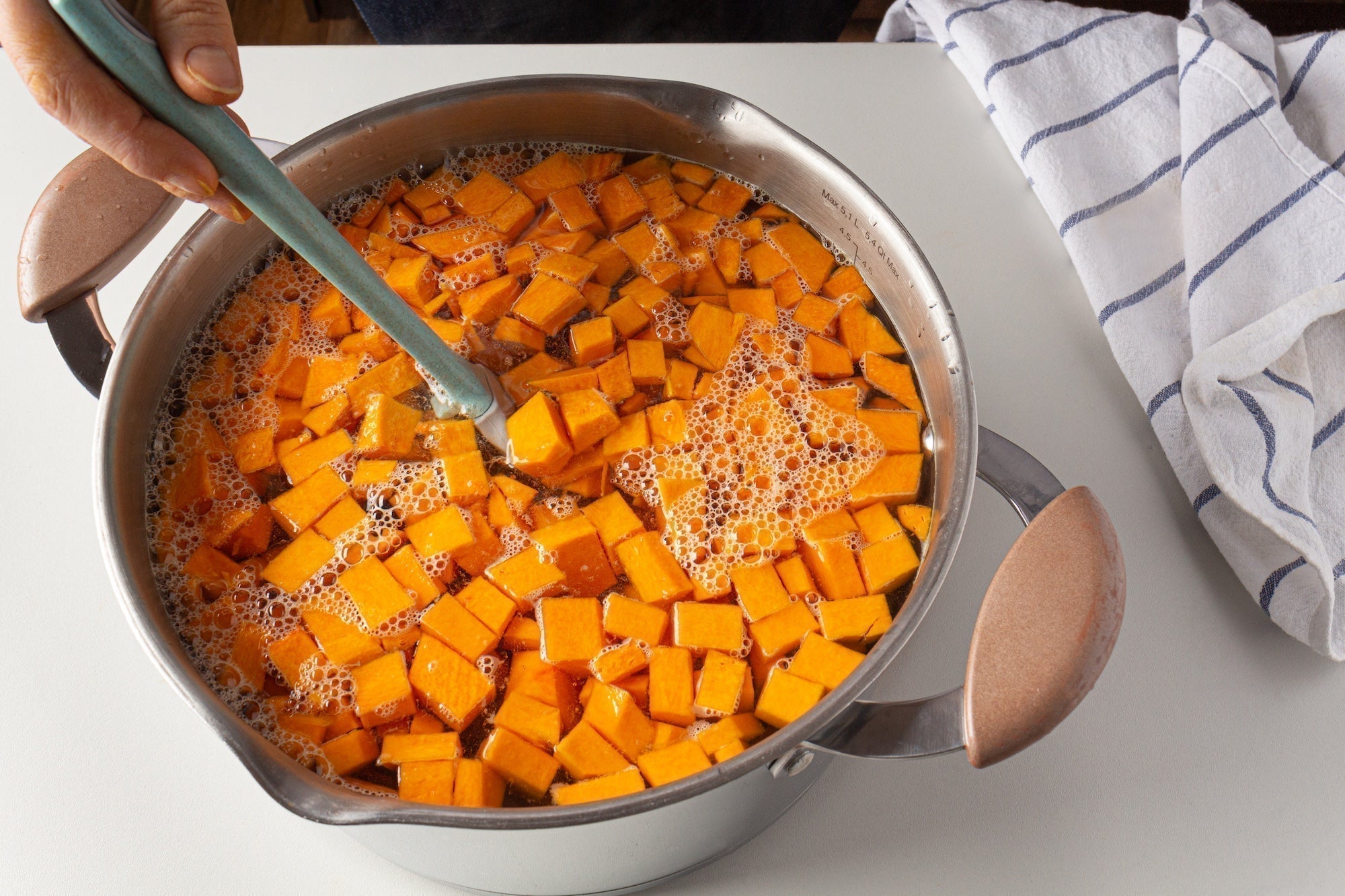 diced pumpkin and water in a cooking pot